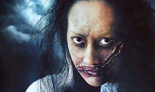 A filipina is shown with unkempt hair and dark circles under her eyes. A large slash wound crosses her face from the right of her mouth up to the left side of her eye.