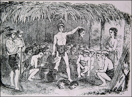 Image depicts a Tinguan in native attire, holding a head in front of several villaers sitting around him.  Two other heads lay in front of him.cutting the heads of their rival tribe.
