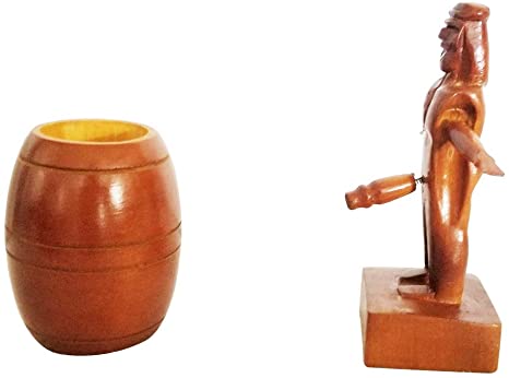 A wooden figure is placed in a barrel with a disproportionately sized, spring-loaded penis, that jumps to action when the barrel is removed.