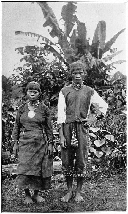 A male and female Manobo pose in traditional dress.
