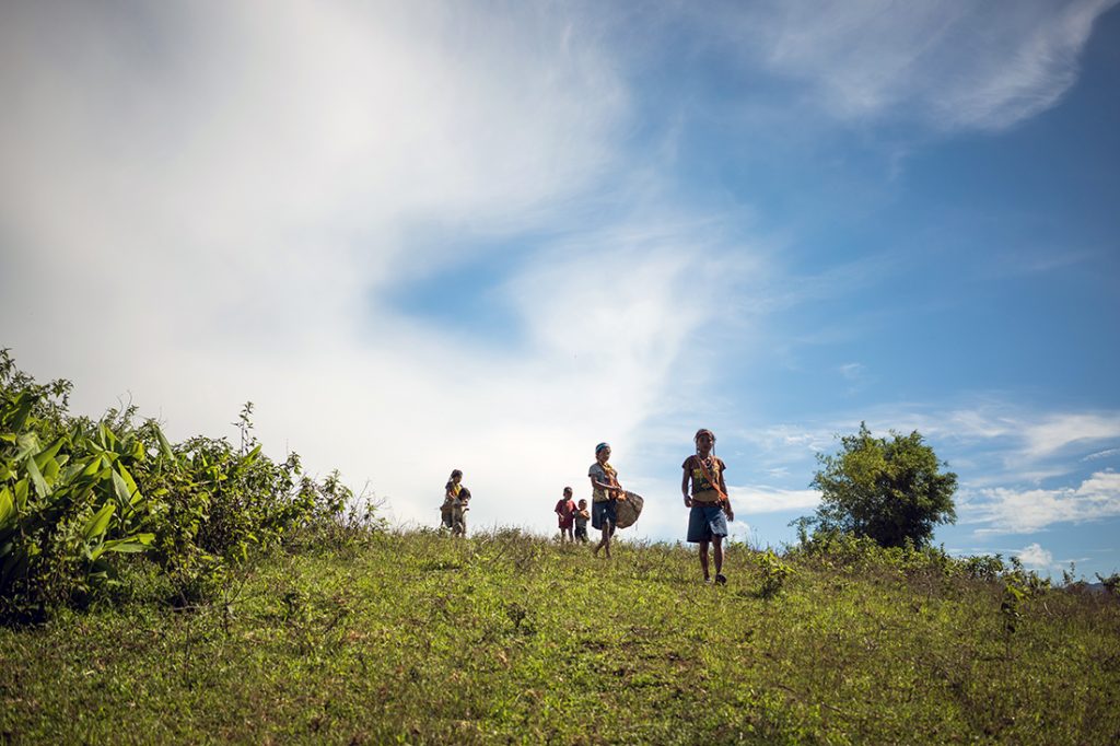 Buhid women walk home from the village gathering