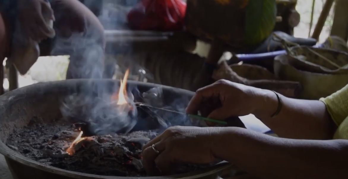 a healer concocts a fire with smoke
