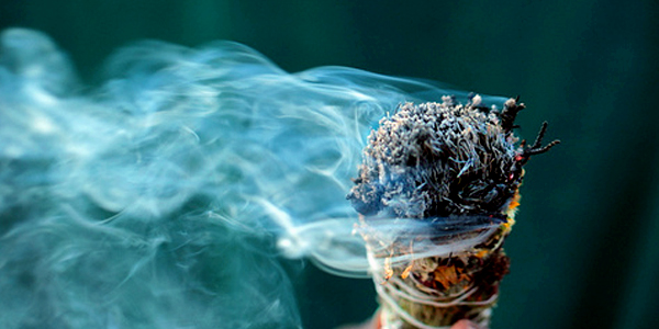 A sage smudging stick smoking.